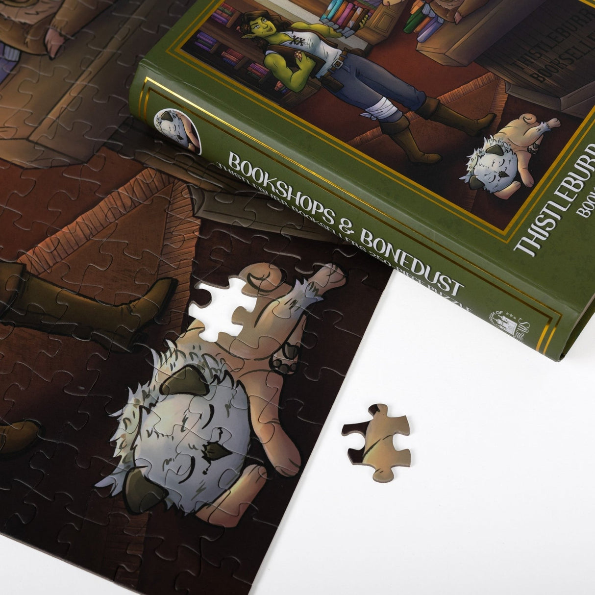Kingdom of Threads: Thistleburr Bookshop Keepsake Puzzle | Bookshops & Bonedust - 250 Pieces